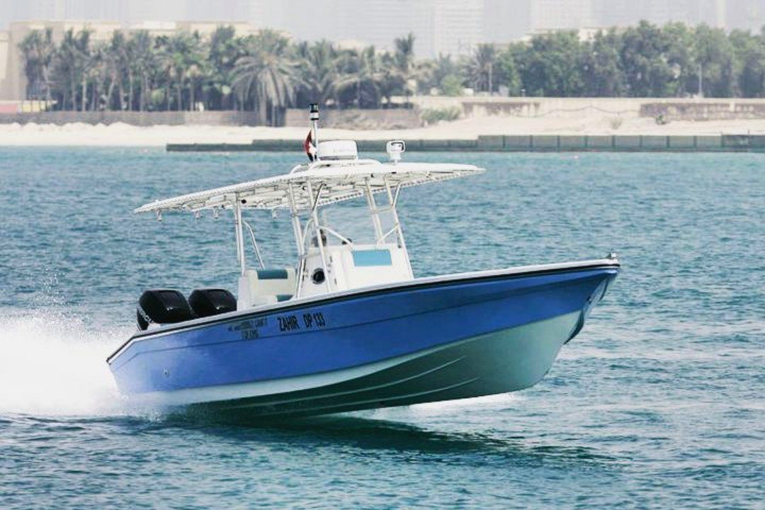 Center console fishing boat on plane