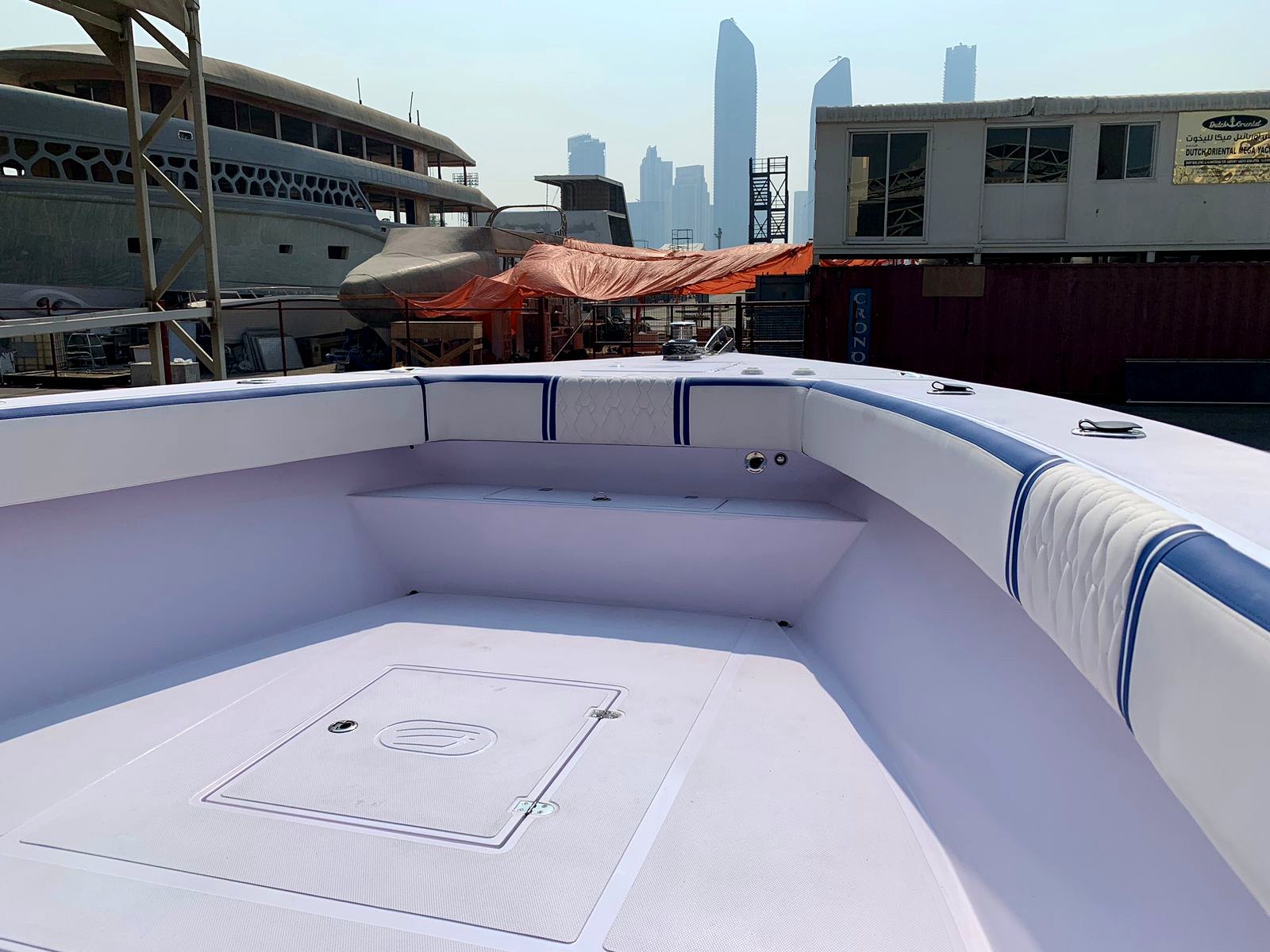 Boat foredeck with Abu Dhabi skyline backdrop