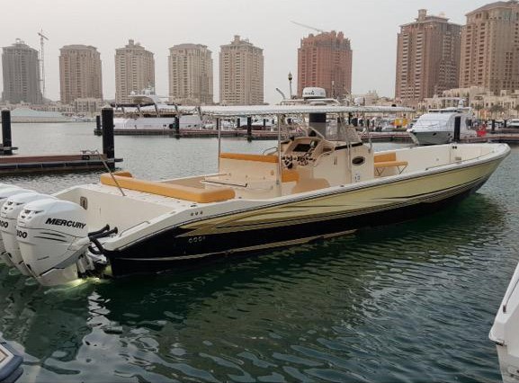Black and tan center console powered by twin Mercury 300 outboards at The Pearl marina